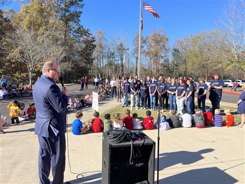 Dr. Nichols addressing crowd at Heritage Elementary